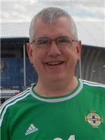 Patrick Magennis - From Belfast, Northern Ireland originally, and married to another OMFS surgeon from Northern Ireland but neither of our children likely to be OMFS surgeons. None of us have ever played for Northern Ireland although our namesake does. Chair of Council. Date of Photo: 2016